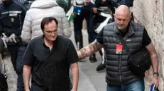 Quentin Tarantino arriva scortato al Teatro Grande di Brescia - Foto NewReporter/Papetti © www.giornaledibrescia.it