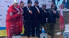 Il podio con Rovelli e Bertagnolli ai campionati mondiali paralimpici di sci
