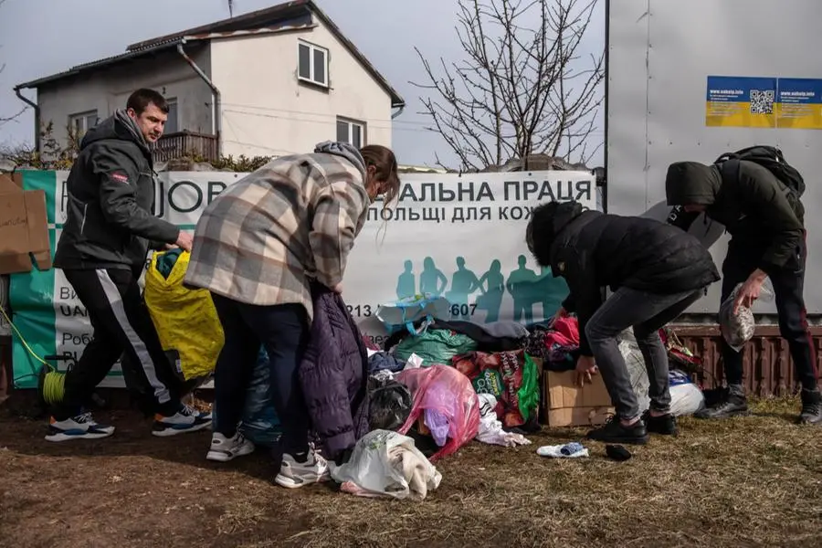 Profughi al confine tra Ucraina e Polonia