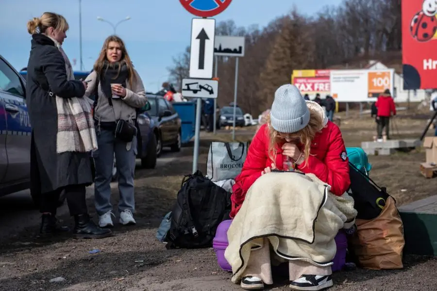 Profughi al confine tra Ucraina e Polonia