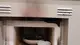 A fine prova, fumo nero e fuliggine sul forno e sulle superfici