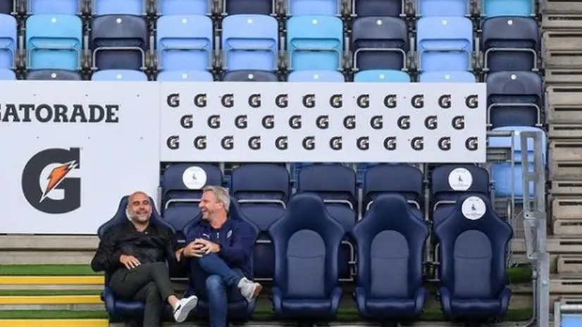 Pep Guardiola e Markus Schopp ieri e al Brescia Calcio