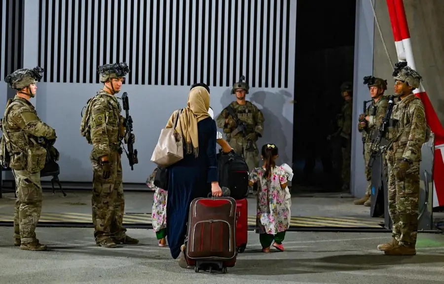 Afghani in fuga a Kabul