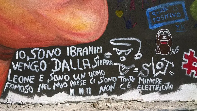 I murales in via Milano di Jupiterfab e degli studenti della Romanino