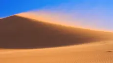 Sabbia del deserto sollevata dal vento - © www.giornaledibrescia.it