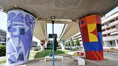 La stazione di Sanpolino tra due piloni coperti da colorati murales - New Eden Group © www.giornaledibrescia.it