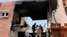 Un'abitazione distrutta da un'esplosione a Tripoli - Foto Ansa/Epa