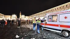 I soccorsi in piazza San Carlo - Foto Ansa/Alessandro Di Marco