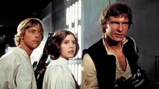Carrie Fisher tra Mark Hamill ed Harrison Ford