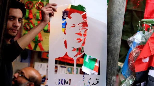 epa11113712 A vendor holds a picture of jailed former Prime Minister Imran Khan following a court verdict imprisoning Khan for 10 years, in Peshawar, Pakistan, 30 January 2024. Former Pakistani Prime Minister Imran Khan and his top aide Shah Mahmood Qureshi have been sentenced to 10 years in jail for leaking official secrets, just days before the general elections scheduled for 08 February. The sentencing took place following a trial conducted within the prison where Khan has been detained, despite previous rulings declaring the jail trial as illegal. Khan and Qureshi are accused of leaking diplomatic correspondence between Washington and Islamabad during Khan's tenure as prime minister. The Pakistan Tehreek-e-Insaf (PTI) party has vowed to challenge the decision in a higher court. The case has raised serious questions about the transparency of the trial and has been marred by allegations of pre-vote rigging, with Khan's party facing suppression. EPA/BILAWAL ARBAB