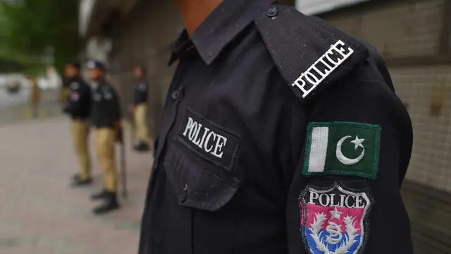 epa10787575 Police stand guard to contain supporters of Pakistan's former prime minister and head of opposition party Pakistan Tehreek-e-Insaf (PTI), Imran Khan, a day after he was arrested following court orders that sentenced him to three years in prison in the Toshakhana case, in Karachi, Pakistan, 06 August 2023. Imran Khan has been arrested by Punjab police after an Islamabad trial court found him guilty of 'corrupt practices' in the Toshakhana case, PTI's general secretary Omar Ayub confirmed. The court sentenced him to three years in prison and imposed a fine of Rs 100,000 for concealing details of Toshakhana gifts. Khan's lawyers were not present during the trial. Khan's sentencing comes three months after his previous arrest in the Al-Qadir Trust case, which led to widespread violence and a crackdown against his party. EPA/SHAHZAIB AKBER