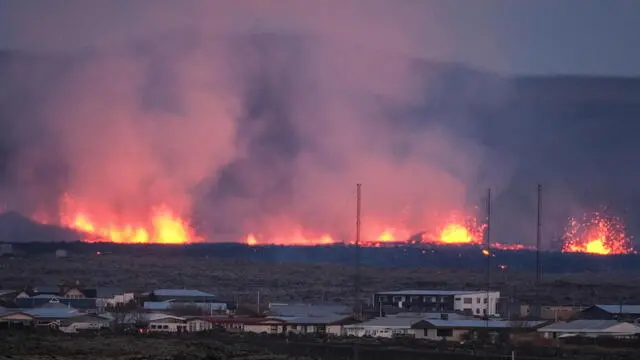 epaselect epa11077207 Lava explosions and rising smoke after a volcanic eruption near the town of Grindavik, in the Reykjanes peninsula, southwestern Iceland, 14 January 2024. A volcanic eruption began north of the town of Grindavík on the Reykjanes peninsula on 14 January, prompting authorities in Iceland to evacuate the small fishing town in the early morning as a precaution. The eruption is not expected to impact additional populated areas and does not present a 'threat to life', the Government of Iceland stated, adding that there are no disruptions to flights to and from Iceland. This is the second eruption in the area since December 2023, and the fifth since 2021.  EPA/ANTON BRINK