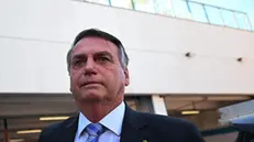 epa10926182 Former Brazilian president Jair Bolsonaro leaves the Federal Police headquarters after testifying in the case of several businessmen who allegedly supported the 2023 Brazilian Congress attack, in Brasilia, Brazil, 18 October 2023. The parliamentary commission on the 08 January 2023 coup attempt in Brazil began debating its final report, which accuses Bolsonaro of having conspired to try to overthrow the Government of progressive Luiz Inacio Lula da Silva.  EPA/Andre Borges
