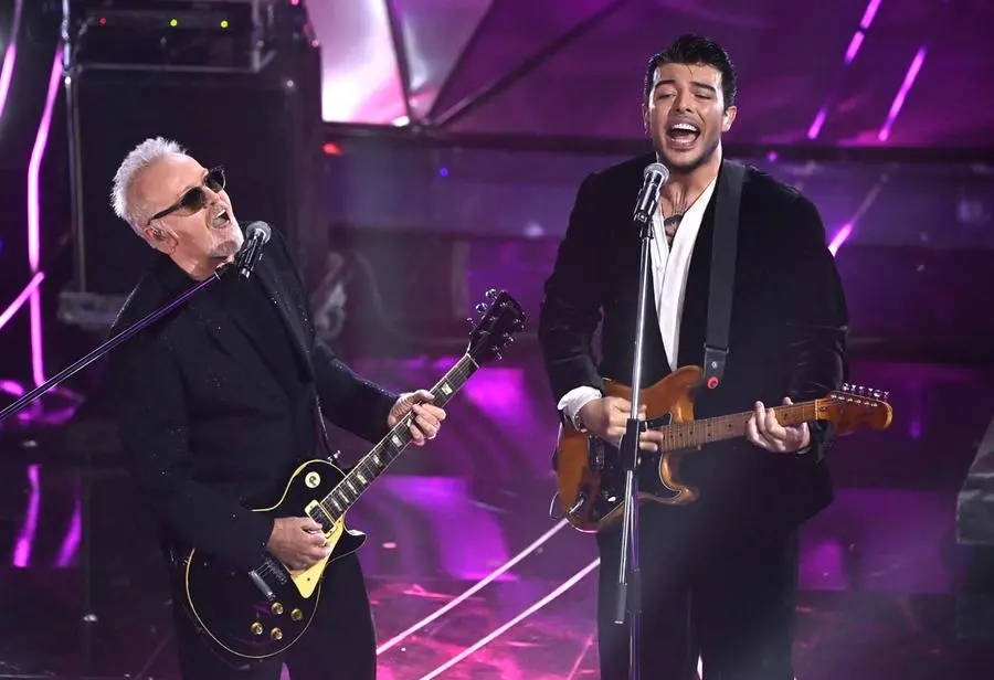 Italian singer Umberto Tozzi (L) with Italian singer Stash of the Italian band The Kolors perform on stage at the Ariston theatre during the 74th Sanremo Italian Song Festival, Sanremo, Italy, 09 February 2024. The music festival will run from 06 to 10 February 2024. ANSA/RICCARDO ANTIMIANI