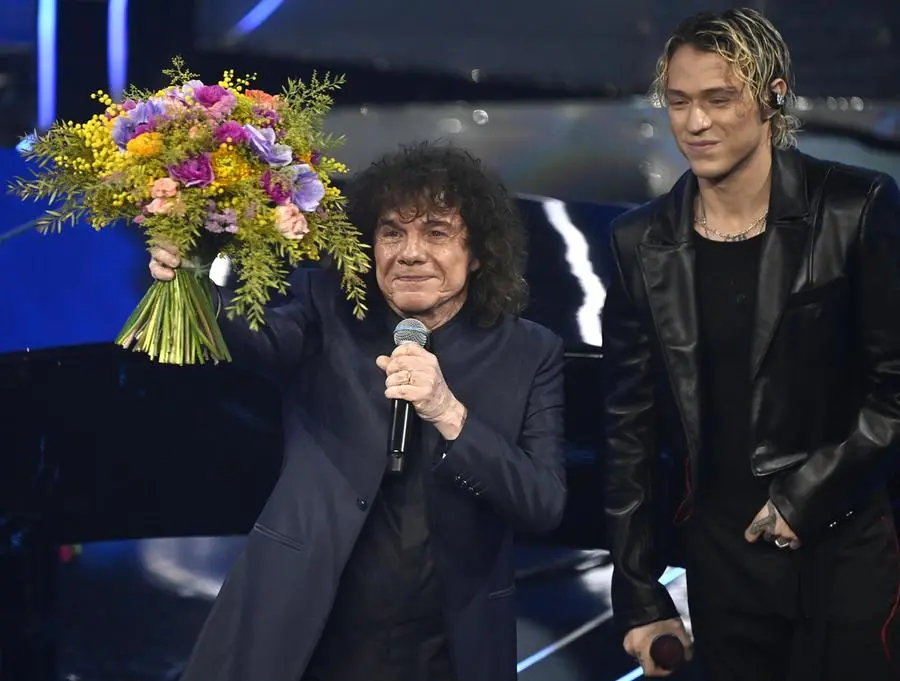 Italian singers Irama (R) and Riccardo Cocciante perform on stage at the Ariston theatre during the 74th Sanremo Italian Song Festival in Sanremo, Italy, 09 February 2024. The music festival runs from 06 to 10 February 2024.   ANSA/RICCARDO ANTIMIANI