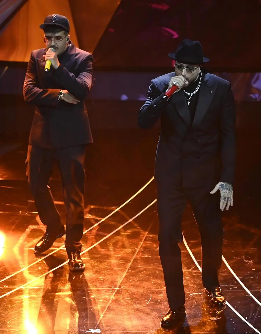Italian singes Geolier (L) and  Gue' perform on stage at the Ariston theatre during the 74th Sanremo Italian Song Festival in Sanremo, Italy, 09 February 2024. The music festival runs from 06 to 10 February 2024.   ANSA/RICCARDO ANTIMIANI