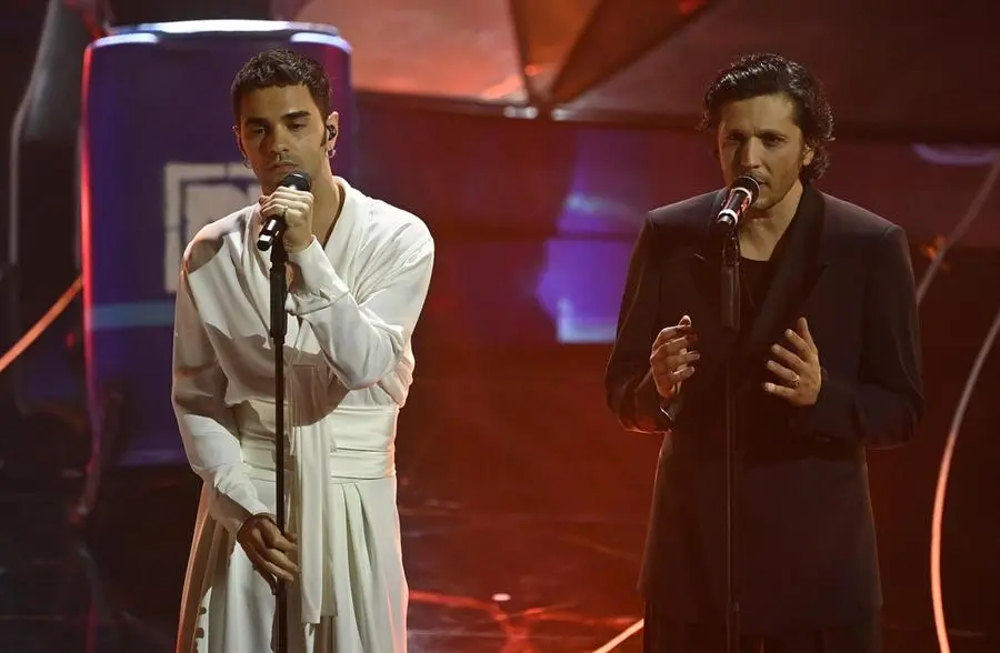 Italian singers Maninni (L) with Ermal Meta perform on stage at the Ariston theatre during the 74th Sanremo Italian Song Festival in Sanremo, Italy, 09 February 2024. The music festival runs from 06 to 10 February 2024.   ANSA/RICCARDO ANTIMIANI