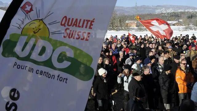 epa02480709 Delegates of the Swiss people's party SVP/UDC participate the party's assembly in Coinsins, western Switzerland, 04 December 2010. Reports state that the assembly was held in an 'open field' after they were refused to meet in the University of Lausanne due to security reasons.  EPA/LAURENT GILLIERON