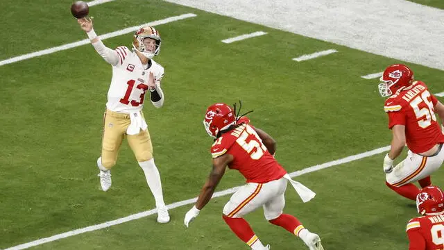 epa11146368 San Francisco 49ers quarterback Brock Purdy (L) throws a pass as the Kansas City Chiefs defensive end Mike Danna (3-R), George Karlaftis (2-R) and Tershawn Wharton (R) defend during the first half of Super Bowl LVIII between the Kansas City Chiefs and the San Fransisco 49ers at Allegiant Stadium in Las Vegas, Nevada, USA, 11 February 2024. The Super Bowl is the annual championship game of the NFL between the AFC Champion and the NFC Champion and has been held every year since 1967. EPA/CAROLINE BREHMAN