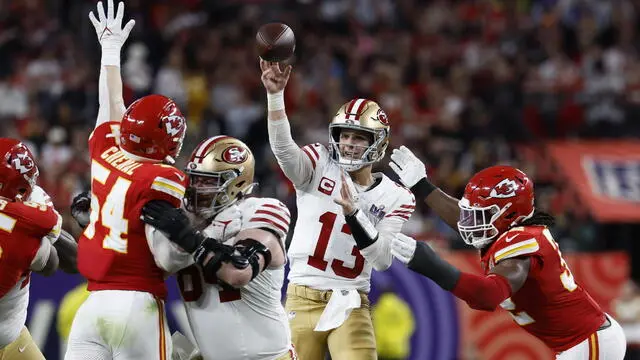 epa11146433 San Francisco 49ers quarterback Brock Purdy (C) passes to San Francisco 49ers running back Christian McCaffrey during the first half of Super Bowl LVIII between the Kansas City Chiefs and the San Fransisco 49ers at Allegiant Stadium in Las Vegas, Nevada, USA, 11 February 2024. The Super Bowl is the annual championship game of the NFL between the AFC Champion and the NFC Champion and has been held every year since 1967.  EPA/JOHN G. MABANGLO