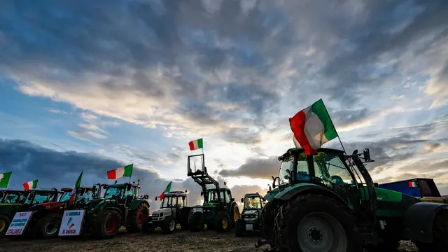 The tractors of Italian farmers of the 'Riscatto Agricolo' (Agricultural redemption) movement on a field near the Nomentana Consular road near Rome, Italy, 12 February 2024. ANSA/FABIO FRUSTACI