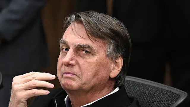 epa10806412 The former president of Brazil, Jair Bolsonaro, participates in a ceremony to receive the title of citizen of Goiania in the local legislative assembly in Goiania, Brazil, 18 August 2023. EPA/Andre Borges