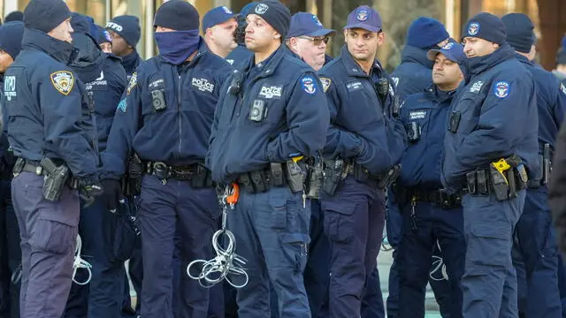 epa11025722 Police watch protesters demonstrate outside of United Nations Headquarters after the UN General Assembly voted in favor of a non-binding ceasefire in New York, New York, USA, 12 December 2023. The emergency session passed with 153 countries in favour, 10 against, and 23 abstentions.  EPA/STRINGER