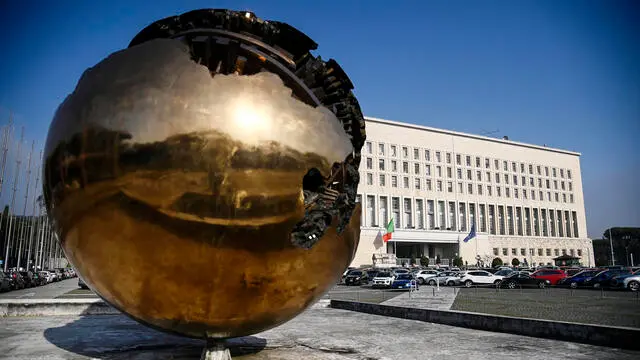 The flag of Farnesina's Palace in Rome at half-mast in mourning for the murder of Ambassador Luca Attanasio, 23 February 2021. ANSA/RICCARDO ANTIMIANI