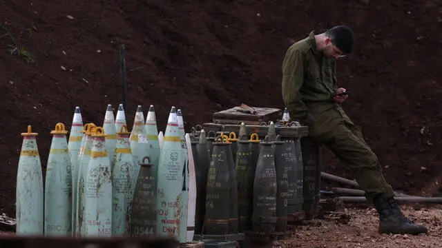 epa11085565 An Israeli soldier of an artillery unit located at the Israeli border with Lebanon, as tension continue to rise between the two countries, at an undisclosed location 17 January 2024. The Israeli army reported that an anti-tank missile launch from Lebanon toward the area of Gladiola was identified. In response, fighter jets struck Hezbollah terrorist infrastructure and military compounds in the area of Hula in Lebanon.  EPA/ATEF SAFADI