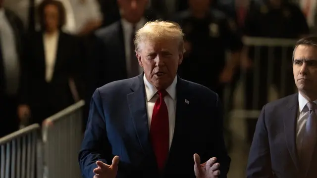 epa11155113 Former president Donald J. Trump briefs the press prior to a pre-trial conference at a New York courthouse in New York, New York, USA, 15 February 2024. Trump is facing 34 felony counts of falsifying business records related to payments made to adult film star Stormy Daniels during his 2016 presidential campaign. EPA/David Dee Delgado
