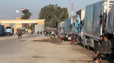 epa11003747 The humanitarian aid convoy bound for the Gaza Strip, is seen parked outside Rafah border gate, at the Rafah border crossing, Egypt 30 November 2023 According to the head of the Egyptian Red Crescent Society in North Sinai Khaled Zayed on 28 November, 220 flights have landed at Arish airport in Egypt since 12 October carrying about 5,500 tons of aid to Palestinians in the Gaza Strip. A  ceasefire originally agreed upon by Israel and Hamas on 24 November, was extended by 24 hours on 30 November, while more talks are to continue for a possible further extension.  EPA/KHALED ELFIQI