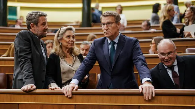 epa11114177 Spain's opposition leader Alberto Nunez Feijoo (2-R) of the People's Party (PP) attends a plenary session at the Spanish Lower House to vote on the so-called Amnesty Law, in Madrid, Spain, 30 January 2024. The amnesty law is part of a deal struck by the Spanish prime minister's Spanish Socialist Workers' Party (PSOE) to form a new minority coalition government with the support of Catalan and Basque pro-independent parties following an inconclusive election in July 2023. The bill would grant amnesty to people facing legal issues for involvement in Catalonia's failed 2017 independence bid.  EPA/BORJA SANCHEZ-TRILLO