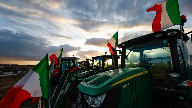 The tractors of Italian farmers of the 'Riscatto Agricolo' (Agricultural redemption) movement on a field near the Nomentana Consular road near Rome, Italy, 12 February 2024. ANSA/FABIO FRUSTACI