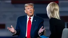 epa11168817 Former US President and current Republican presidential candidate Donald Trump (L) speaks to Fox News host Laura Ingraham (R) during a Fox News town hall in Greenville, South Carolina, USA, 20 February 2024. Trump is running against former South Carolina governor Nikki Haley in the South Carolina Republican presidential primary, scheduled for 24 February 2024.  EPA/JIM LO SCALZO
