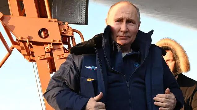 epa11172552 Russian President Vladimir Putin answers questions from journalists after a test flight aboard a Tupolev Tu-160 M strategic missile carrier during a visit to the Kazan Aviation Factory named after Sergei Gorbunov, a branch of the Tupolev military industry company, in Kazan, Republic of Tatarstan, Russia, 22 February 2024. Tu-160 (according to NATO codification - Blackjack) is a supersonic strategic missile carrier-bomber with variable sweep wings, developed at the Tupolev Design Bureau in the 1970-1980s. Although serial production of the Tu-160 was discontinued in the 1990s, works are underway in Russia to resume construction of the aircraft in a new look - Tu-160M. EPA/DMITRIY AZAROV/SPUTNIK/KREMLIN POOL MANDATORY CREDIT