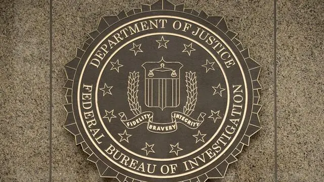 epa05171661 (FILE) The logo of the Federal Bureau of Investigation (FBI) at the J. Edgar Hoover FBI Building in Washington DC, USA, 22 December 2014. Apple chief executive Tim Cook refused the judge's order in an open letter posted on the company's website 16 February 2016 shortly after Judge Sheri Pym ordered the company to help the FBI access data they believe is stored on the phone. The December 2 attack in San Bernardino was carried out by Syed Rizwan Farook and his wife, Tashfeen Malik, at a holiday party at the county office where Farook worked. Fourteen people were killed. Police killed Farook and Malik later that same day in a shoot-out. The FBI wants Apple to help it hack into Farook's iPhone by building a new version of the iOS software that would circumvent security features and install the software on the iPhone, which was recovered during the investigation.  EPA/MICHAEL REYNOLDS
