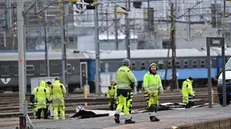 epa11174374 Emergency services clear a platform of debris as train departures in the region have been canceled and all tracks at Gothenburg's central station are without power after a piece of roof was blown off and obstructed power lines, Gothenburg, Sweden, 23 February 2024. Stormy weather has moved in over western Sweden and the Swedish Meteorological and Hydrological Institute has issued several warnings for further strong winds this weekend.  EPA/Björn Larsson Rosvall/TT  SWEDEN OUT