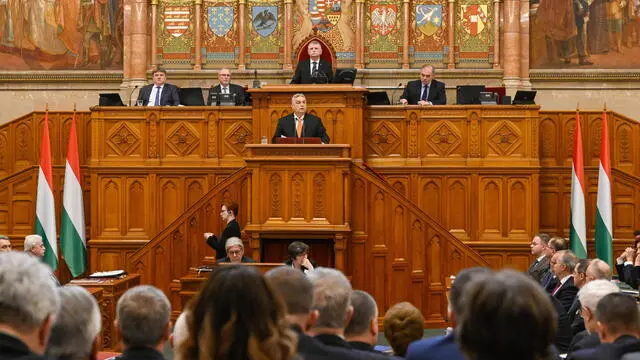 epa11182602 Hungarian Prime Minister Viktor Orban (C, front) delivers his address on the opening day of the spring session of the Hungarian Parliament in Budapest, Hungary, 26 February 2024. In picture is seen Speaker of the Parliament Laszlo Kover (C, back). Hungarian lawmakers are expected to vote about the new head of state on the day. The ruling coalition Fidesz-KDNP nominated Tamas Sulyok, the current head of the Constitutional Court for head of state. EPA/SZILARD KOSZTICSAK HUNGARY OUT