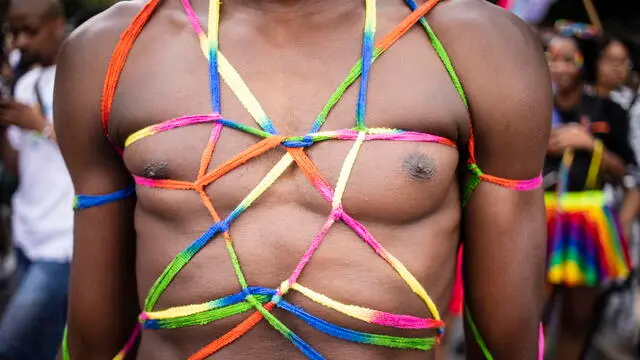 epa10272992 A member of the LGBT community attends the annual Gay Pride march in Johannesburg, South Africa, 29 October 2022. With the exception of South Africa, lesbian, gay, bisexual, and transgender (LGBT) rights in Africa are very poor compared to other areas of the world with some African countries arresting members of the gay community.  EPA/KIM LUDBROOK