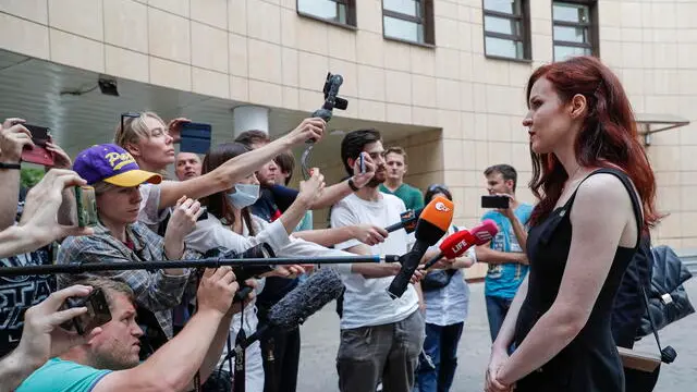 epa09416435 Opposition activist and Navalny's press-secretary Kira Yarmysh (R) speaks to journalists leaving the Preobrazhensky district court after a hearing in Moscow, Russia, 16 August 2021. The court will deliver a verdict to Kira Yarmysh in the so-called 'Sanitary Case' over violating the pandemic regulations imposed by Moscow's authorities, during an unauthorised pro-Navalny rally in January 2021. The court awarded Yarmysh 1.5 years of restriction of liberty, forbidden to change place of residence without notice, to attend mass events, to travel outside Moscow and Moscow region. She is also obliged to report once a month to the Criminal Executive Inspectorate. EPA/MAXIM SHIPENKOV