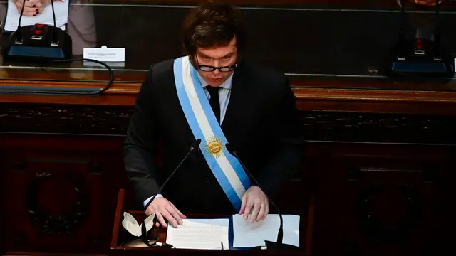 epa11192598 Argentine President Javier Milei delivers his speech at the beginning of the ordinary sessions of the Chamber of Deputies, in Buenos Aires, Argentina, 01 March 2024. Milei denounced that populism stole a good part of the population's income when reviewing the "inheritance" received from the administration of Peronist Alberto Fernandez (2019-2023). EPA/Matias Martin Campaya