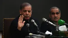 epa11150101 Pakistan's former prime minister and leader of the Pakistan Muslim League-Nawaz (PML-N) party Shehbaz Sharif (L) speaks during a press conference in Lahore, Pakistan, 13 Feburay 2024. PML-N president Shahbaz Sharif announced that the party will sit on the opposition benches if independent candidates form a government at the Centre. He stated that PML-N is in contact with PPP, MQM-P, and JUI parties and they will form an alliance under the leadership of Nawaz Sharif. EPA/RAHAT DAR