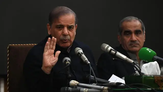 epa11150101 Pakistan's former prime minister and leader of the Pakistan Muslim League-Nawaz (PML-N) party Shehbaz Sharif (L) speaks during a press conference in Lahore, Pakistan, 13 Feburay 2024. PML-N president Shahbaz Sharif announced that the party will sit on the opposition benches if independent candidates form a government at the Centre. He stated that PML-N is in contact with PPP, MQM-P, and JUI parties and they will form an alliance under the leadership of Nawaz Sharif. EPA/RAHAT DAR