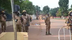 epa10216236 Burkina Faso military close a street in Ouagadougou, Burkina Faso, 30 September 2022. Gunshots have been heard near the presidential palace in Ouagadougou with what some residents claim to be an alleged coup attempt. Access has been blocked by the military to some government buildings including the national assembly and the national broadcaster. In January 2022 the current head of state, Lt-Col Paul-Henri Damiba, ousted President Roch Kabore through a coup. Lieutenant Colonel Paul-Henri Damiba has called for calm. EPA/ASSANE OUEDRAOGO