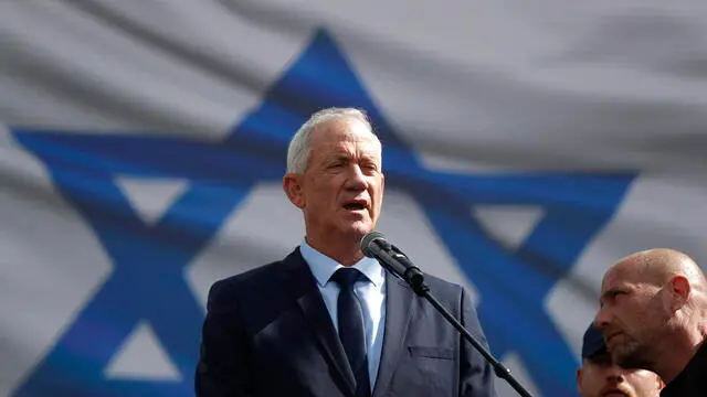 epa10545347 Former Israeli defense minister Benjamin Gantz addresses a rally against the judical overhaul plan outside the Knesset in Jerusalem, Israel, 27 March 2023. Mass protests have been held in Israel for 12 weeks against the government's plans to reform the justice system and limit the power of the Israeli Supreme Court. EPA/ATEF SAFADI