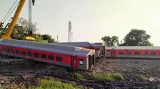 epa10914635 Rescue works continue at the site of a train accident after the 12506 Delhi-Kamakhya North East Express train derailed near the Raghunathpur station in Bihar's Buxar district, India, 12 October 2023. At least four people were killed and nearly 100 injured after the derailment happened at the Raghunathpur railway station, railway officials said. EPA/ASHUTOSH KUMAR PANDEY