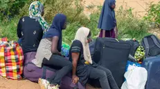 epa10860772 A group of women wait to board dugouts on the Sota river, an affluent of the Niger river, across to Niger near the border town of Malanville, Benin, 12 September 2023, (issued 14 September 2023). Following the coup in Niger on 26 July, Benin closed its border in accordance with one of the decisions taken by the Economic Community of West African States (ECOWAS). As legal cross-boundary road traffic for people, produce and consumer goods has come to a halt in the border town, people are turning to other means to ship their goods from both sides of the Niger River from both sides. EPA/DIDER ASSOGBA