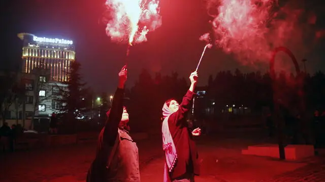 epa10522702 Iranian young girls set off firecrackers during a traditional fire feast called 'Charshanbeh Suri' in Tehran, Iran, 14 March 2023. The festival is held annually on the last Wednesday eve before the Persian New Year (Nowruz), which starts on 21 March, also marking the beginning of spring. Nowruz, which has been celebrated for at least three thousand years, is the most revered celebration in the greater Persian world, which includes the countries of Iran, Afghanistan, Azerbaijan, Turkey, and portions of western China and northern Iraq. EPA/ABEDIN TAHERKENAREH