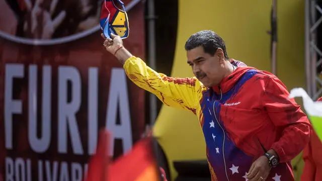 epa11189785 The president of Venezuela, Nicolas Maduro, participates in an event marking the 20th anniversary of the declaration of the nation as an "anti-imperialist country" by former president Hugo Chavez in Caracas, Venezuela, 29 February 2024. Thousands of Chavistas gathered this 29 February on the main Caracas highway to support the president of Venezuela, Nicolas Maduro, in a march marking the 20th anniversary of the nation's declaration as an 'anti-imperialist country.' The massive event, which blocked traffic in part of the Venezuelan capital, brought together followers of Chavismo from different parts of the country who arrived in buses from the interior to participate in the event, in which they were received by the president. EPA/Miguel Gutierrez