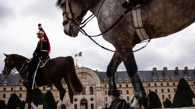 epa11166586 The French Republican mounted guards arrive for a 'Prise d'armes' military ceremony with French President Emmanuel Macron (not pictured) in the courtyard of the Hotel National des Invalides in Paris, France, 19 February 2024. EPA/YOAN VALAT
